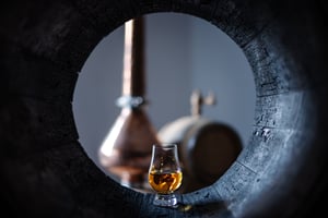 a-glass-of-whiskey-in-oak-barrel-2023-11-27-05-35-35-utc