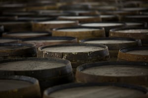 rows-of-wooden-whisky-casks-in-whisky-distillery-2024-10-18-09-54-29-utc