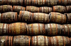 stacked-pile-of-old-whisky-and-wine-wooden-barrels-2024-09-23-08-46-13-utc